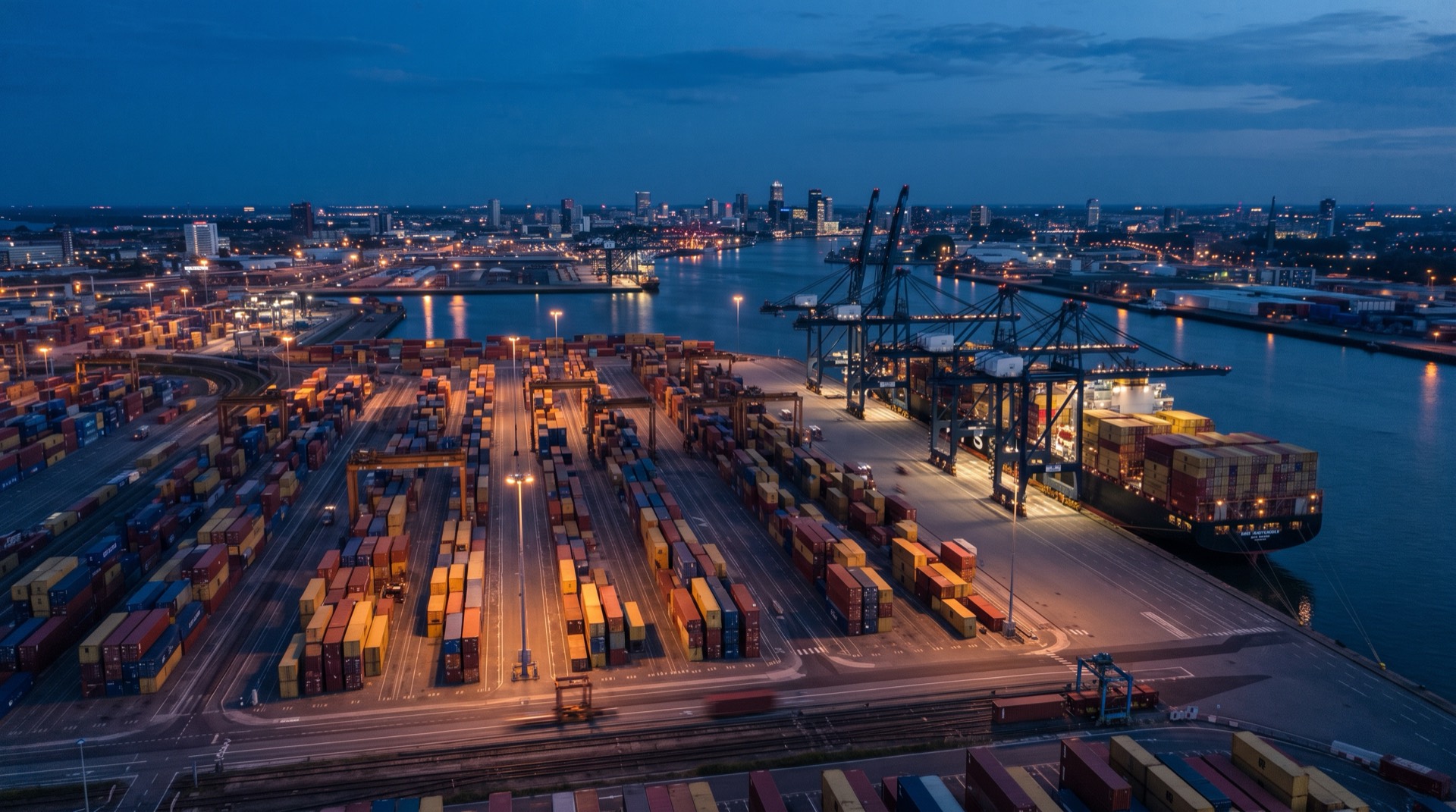 Container terminal at blue hour with gantry cranes and a moored container ship